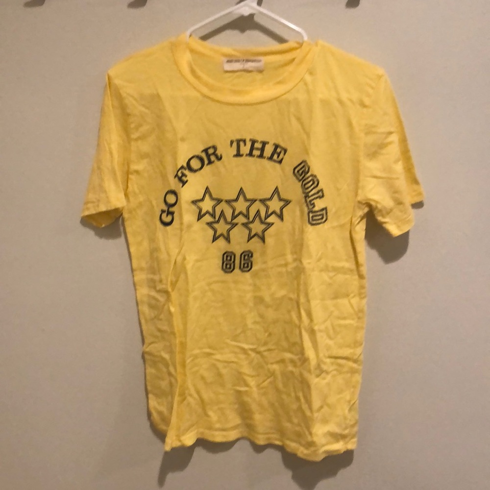 Urban outfitters “go for the gold” yellow tee